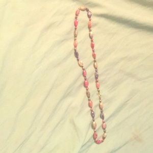 A pastel colored the beaded necklace